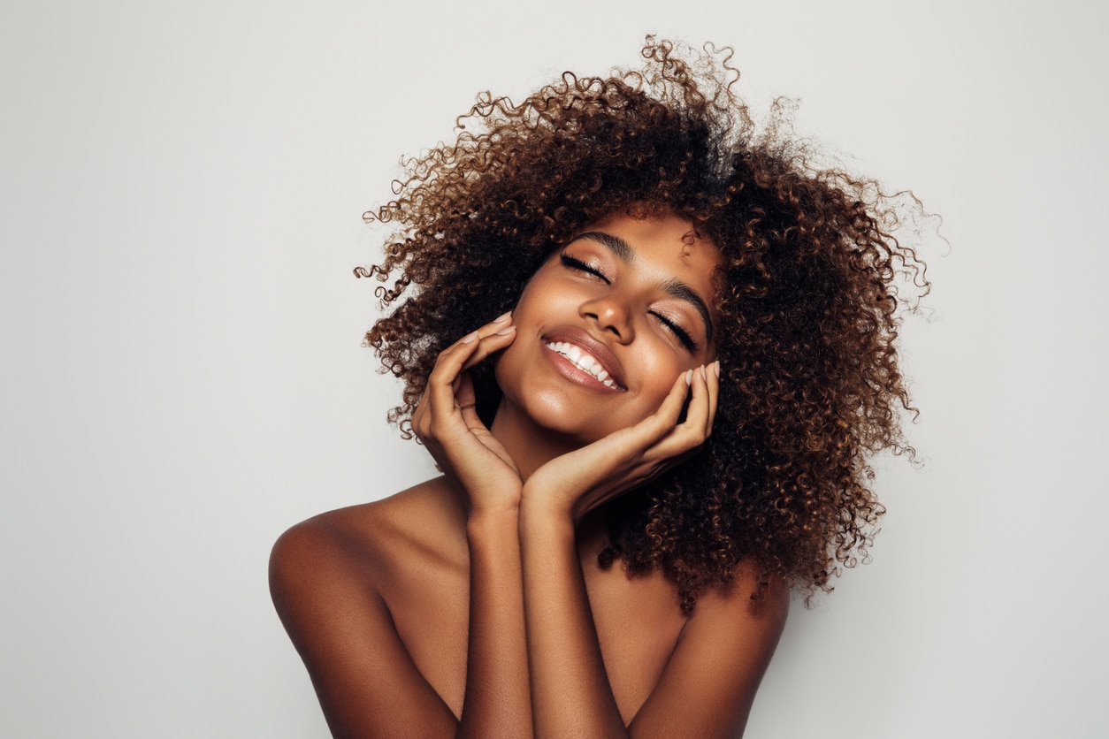 Portrait of young black woman after getting Juvederm treatments