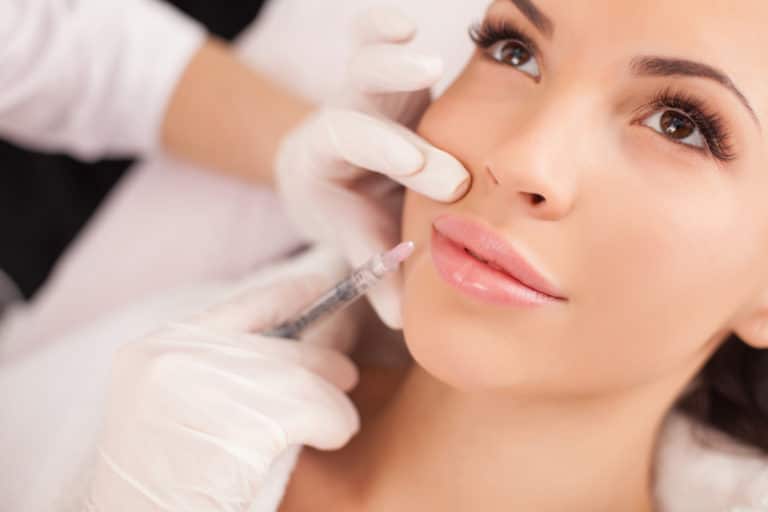 Young woman getting botox injections